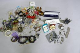 A quantity of costume jewellery, silver pendants, rings, fob watch, badges, filigree bracelet, photo