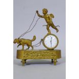 A C19th French Empire Style ormolu mantel clock, with putto and dog, and anthemion decoration,