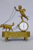 A C19th French Empire Style ormolu mantel clock, with putto and dog, and anthemion decoration,