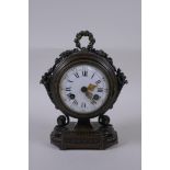 A French bronze mantel clock, the enamel dial with Roman numerals, the movement striking on a