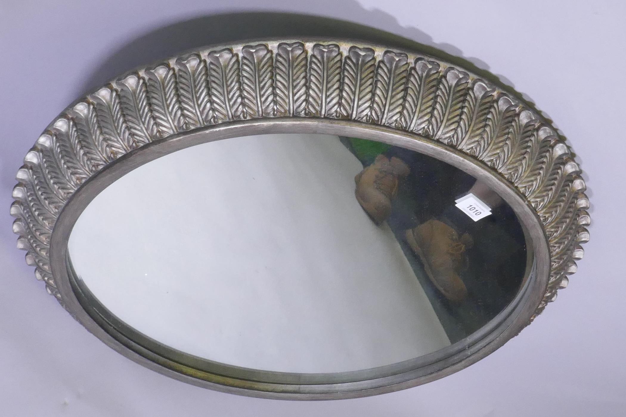 A contemporary metal leaf decorated cushion shaped wall mirror, 68cm diameter - Image 2 of 2