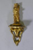 A Chinese carved giltwood figure of a warrior, mounted on a giltwood bracket