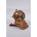 A model copper and brass deep sea diver's helmet, 18cm high