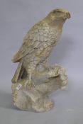 A painted terracotta figure of a falcon, 60cm high