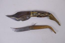 A C19th Spanish brass and horn handled Navaja knife, and a smaller horn handled Navaja knife from