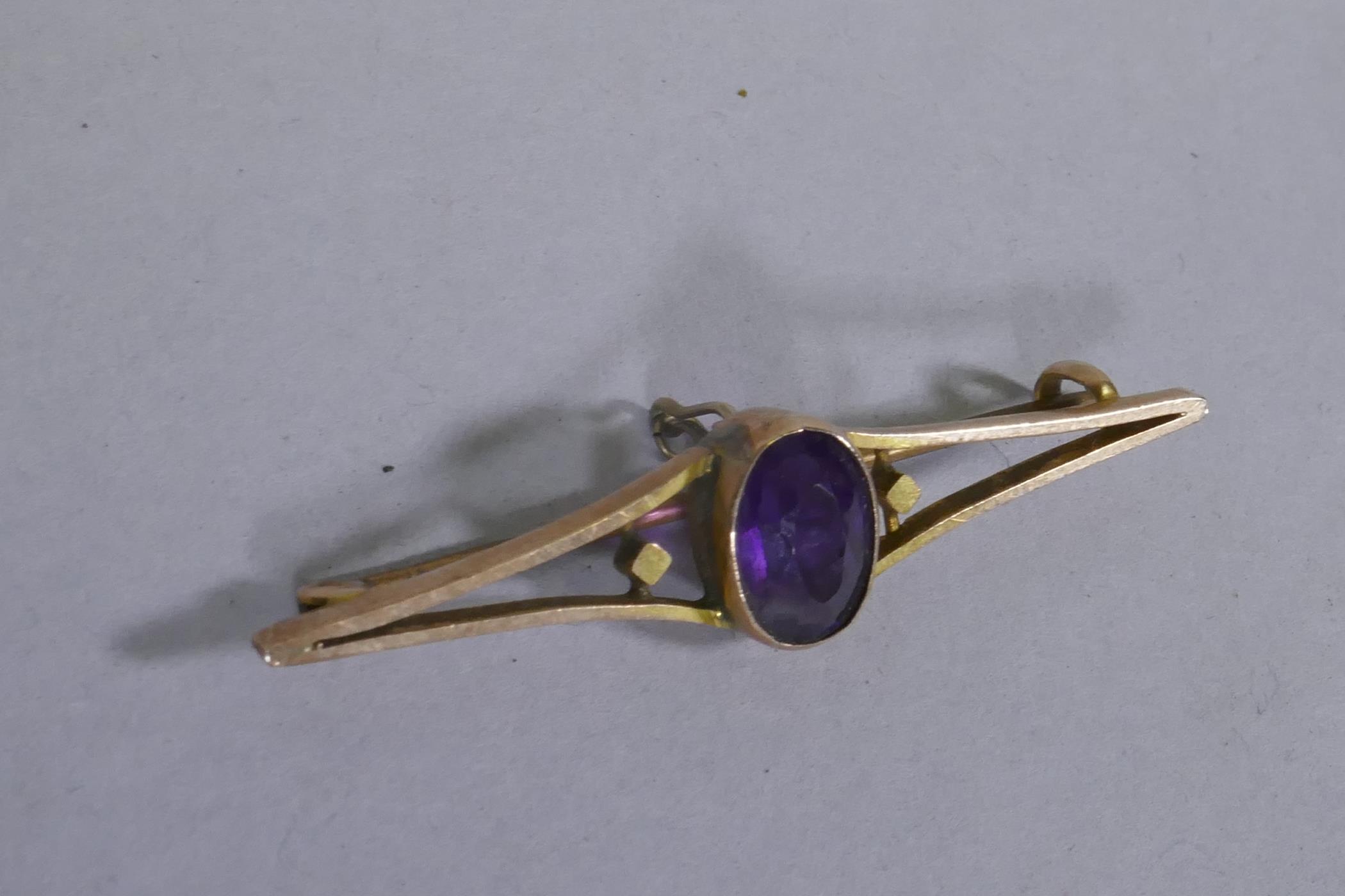 9ct gold bar brooch set with an amethyst, 5cm long, 3.5g gross - Image 2 of 2