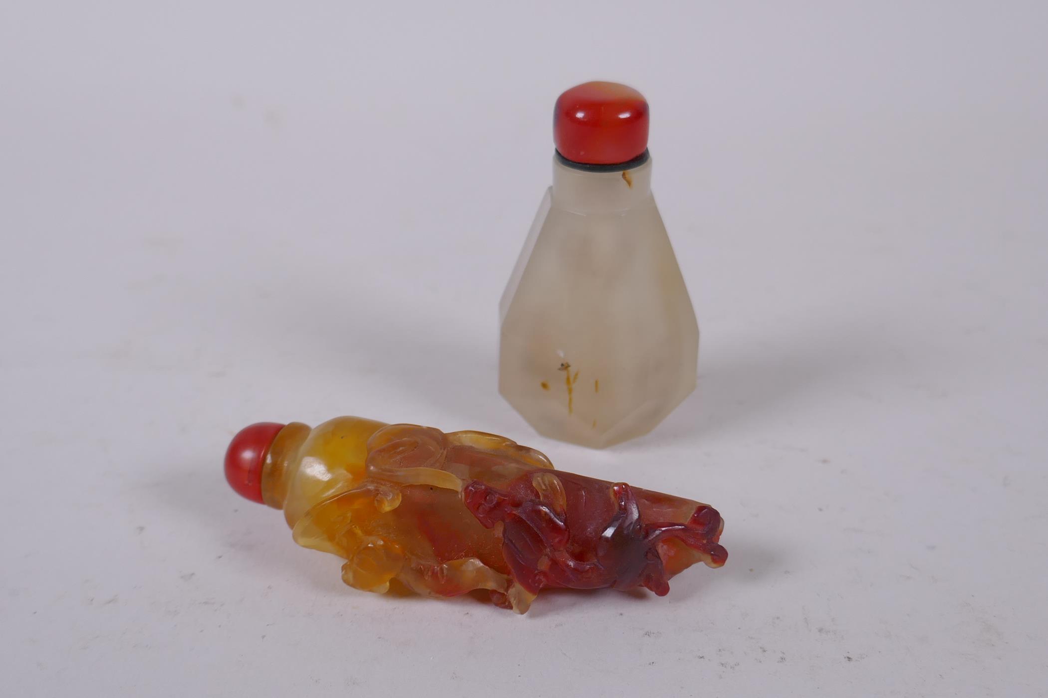 A Chinese agate snuff bottle carved in the form of a chilli with bat and kylin decoration, and a