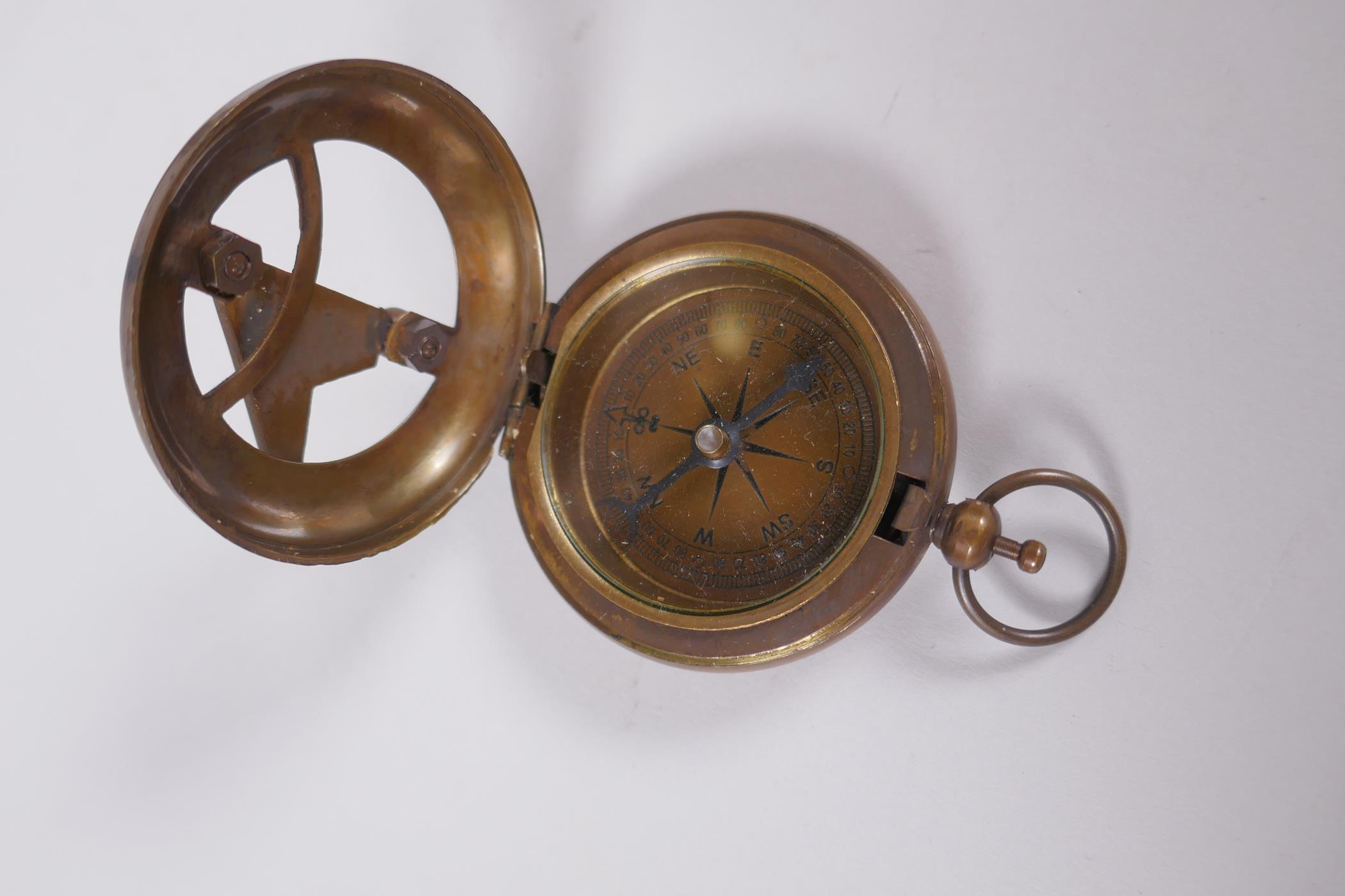 A reproduction brass fob watch sundial compass, and a four draw brass telescope, 39cm long extended - Image 3 of 5