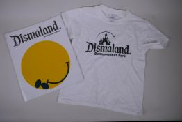 Banksy, Dismaland Bemusement Park programme, 29 x 34cm, and a Dismaland child's T-shirt (7-8)