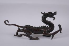 A Chinese filled bronze dragon, 31cm long