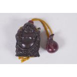 A Japanese carved hardwood Buddha inro with boxwood netsuke sack, the base with inset signed abalone