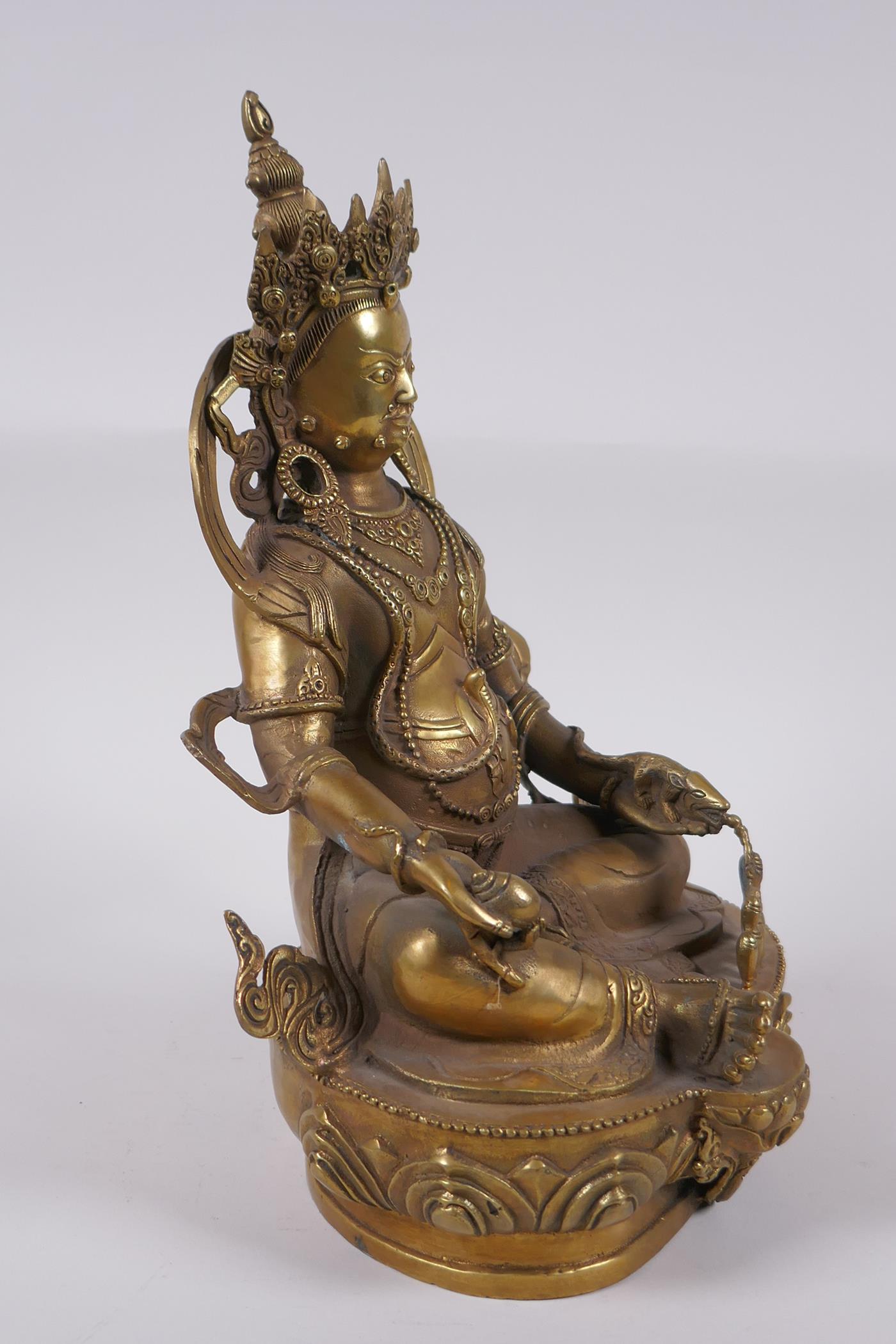 A Tibetan bronze figure of a wrathful deity, impressed double vajra mark to base, 29cm high - Image 3 of 7