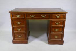 A Victorian mahogany nine drawer pedestal desk, with moulded detail, brass plate handles an