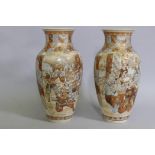 A pair of Meiji period Satsuma vases, decorated with warriors, 40cm high