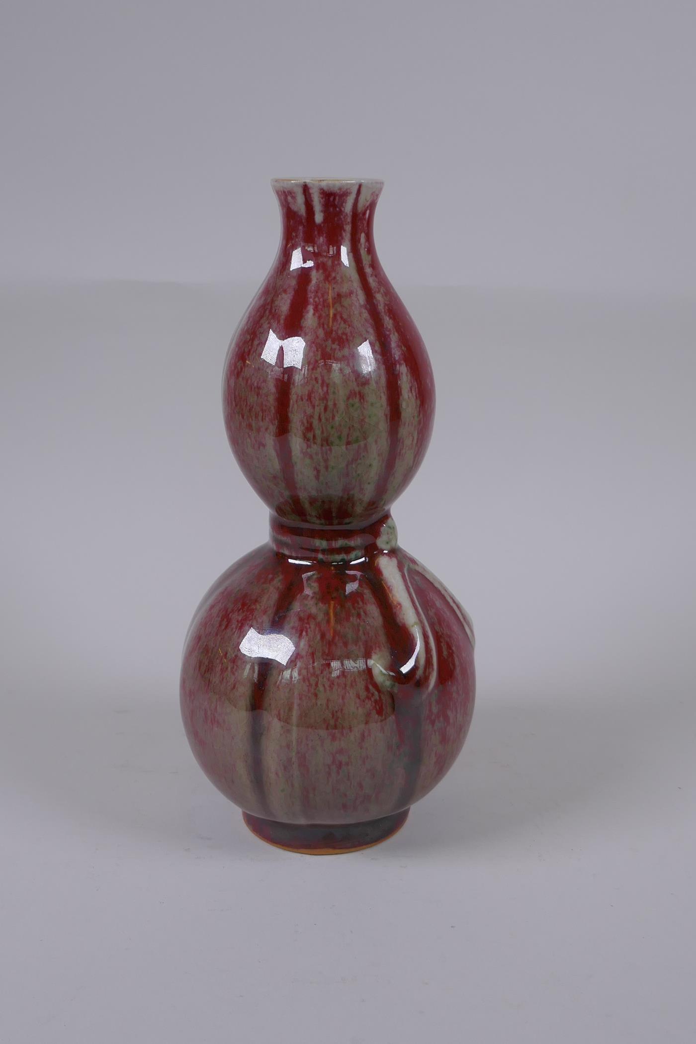 A Chinese flambe glazed double gourd porcelain vase, 25cm high - Image 2 of 4