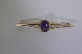 9ct gold bar brooch set with an amethyst, 5cm long, 3.5g gross