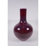 A Chinese flambe glazed porcelain bottle vase, Yong Zheng 6 character mark to base, 33cm high