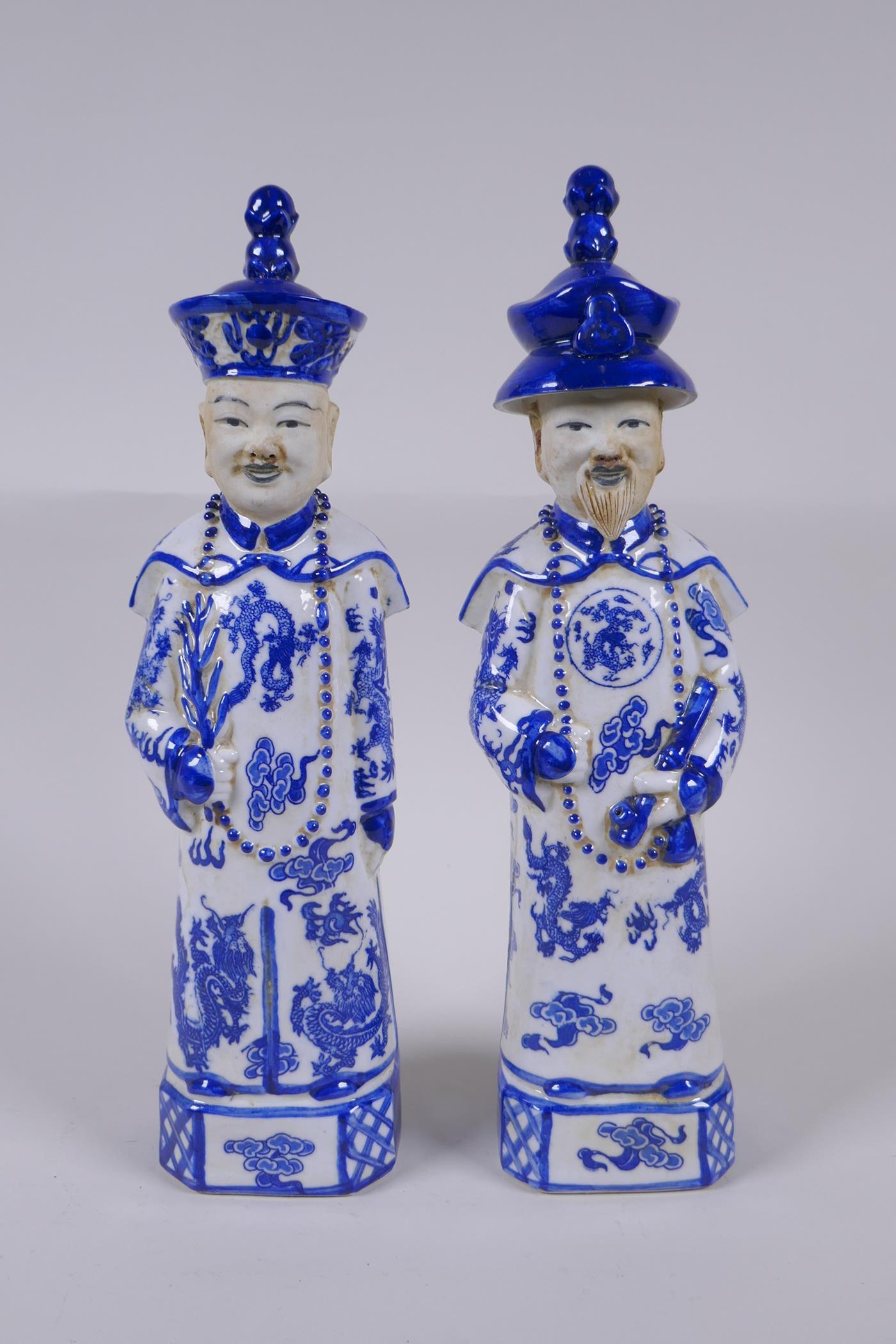 A pair of Chinese Qing Dynasty blue and white porcelain figures, impressed marks to base, 29cm high