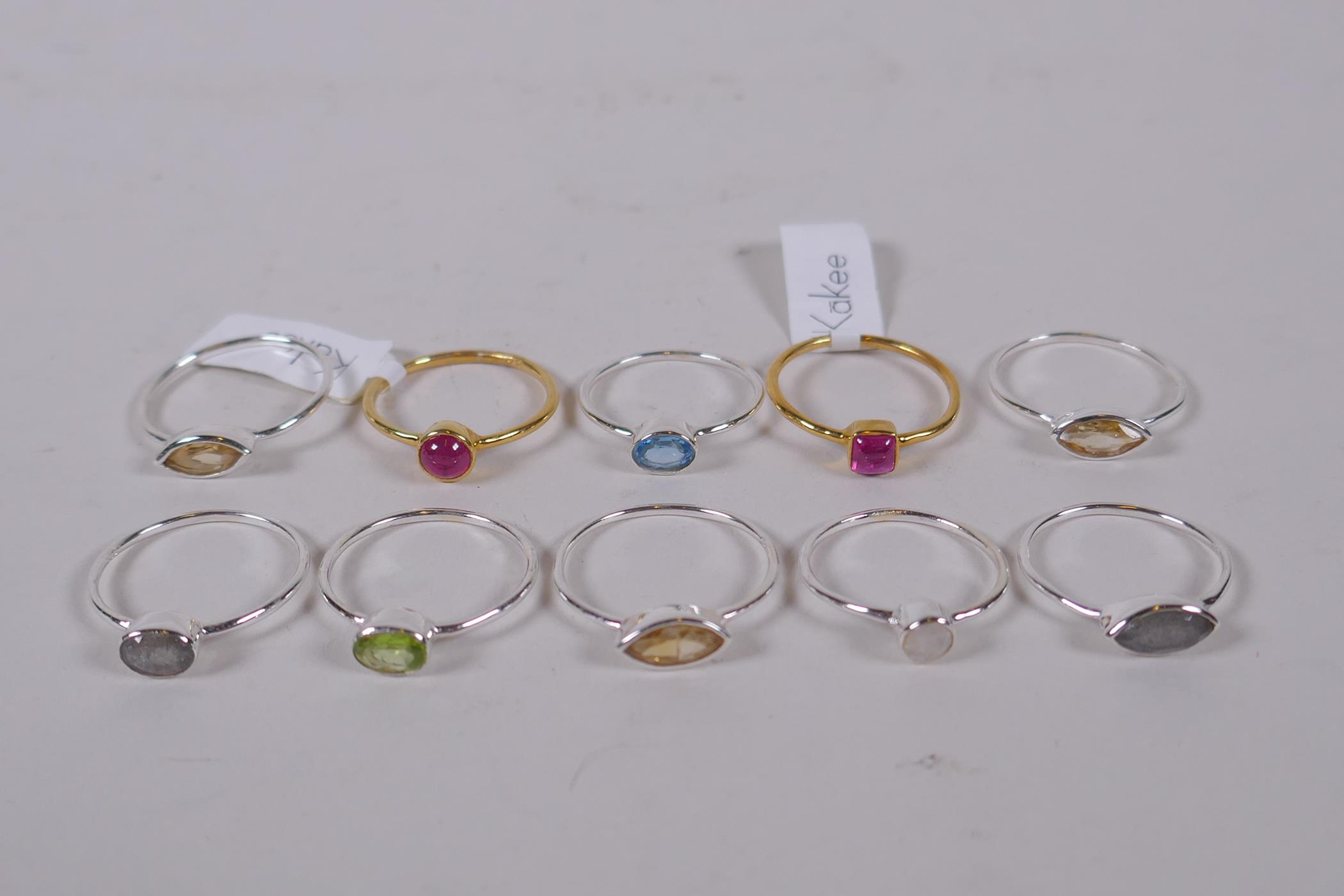 Ten 925 silver and silver gilt lady's dress rings, with assorted stone settings and various sizes