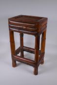 An Oriental bamboo occasional table, 30 x 23cm, 53cm high