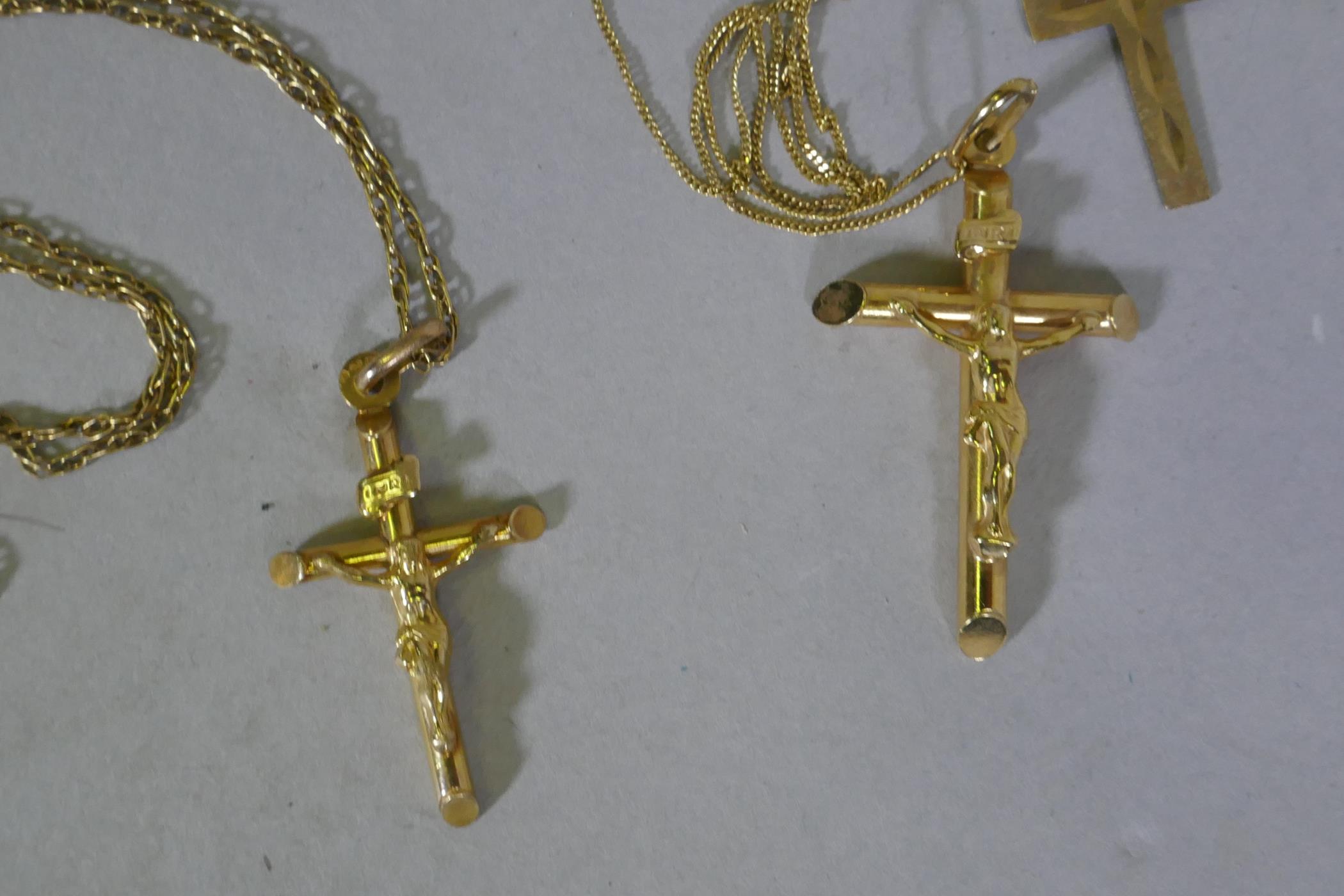 9ct gold, three crucifix, chains and hoop earrings, studs and pendants, 7.7g weighable gold, 9.4g - Image 2 of 4