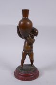 Louis Kley, (French, 1833-1911), bronze figure of a putto carrying a jar, signed, stamped BZP?, on a
