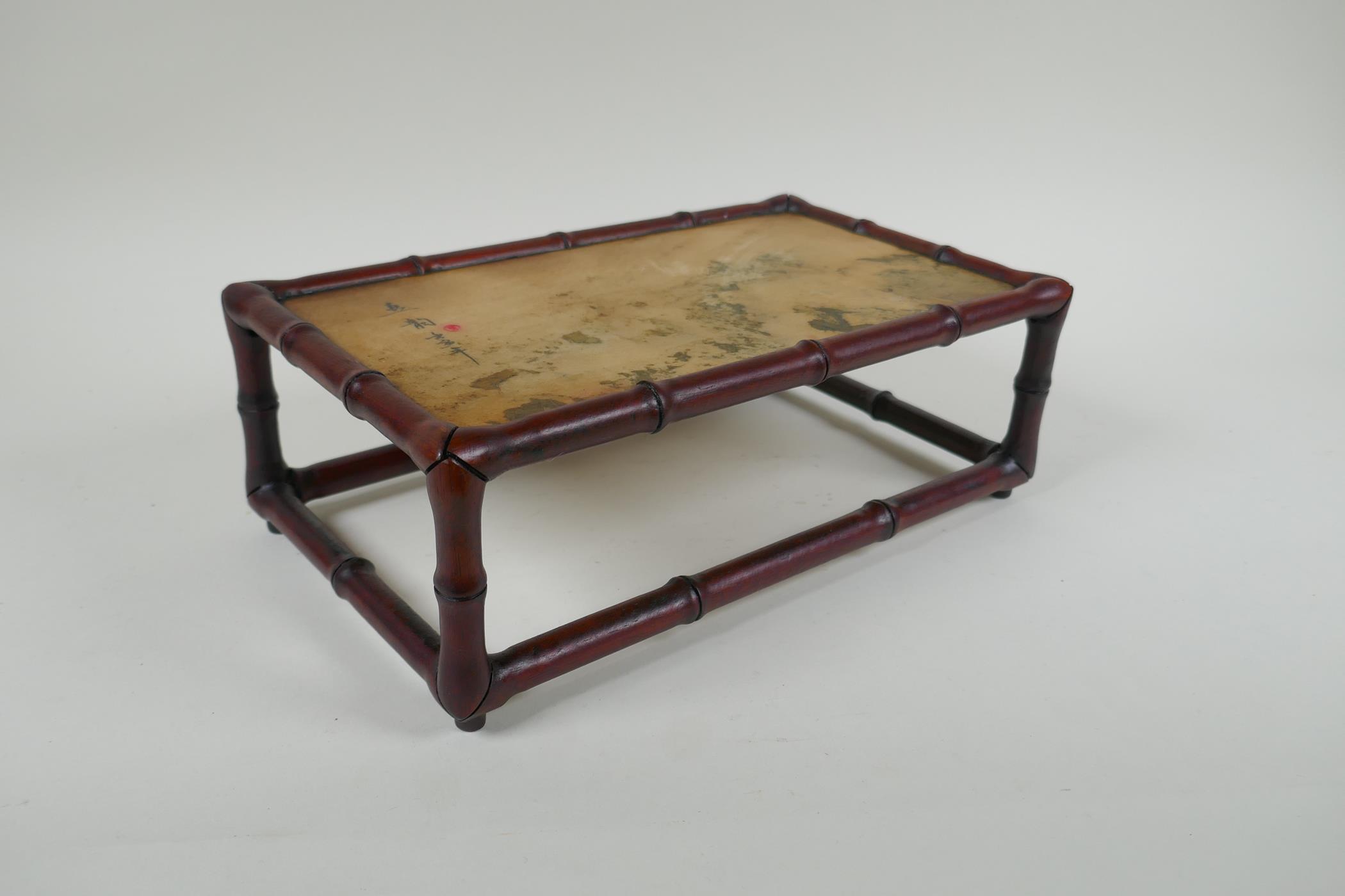 A Chinese carved hardwood stand in the form of bamboo with inset marbled stone top, 30 x 17cm,