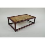 A Chinese carved hardwood stand in the form of bamboo with inset marbled stone top, 30 x 17cm,