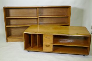 A mid century walnut bookcase with sliding glass doors, 153 x 25 x 84cm, and a teak media unit