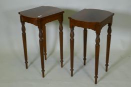 A pair of inlaid mahogany end tables, with shaped tops, raised on fluted tapering supports, 32 x