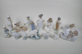 A collection of fourteen Lladro and Nao figurines and animals, largest 22cm high