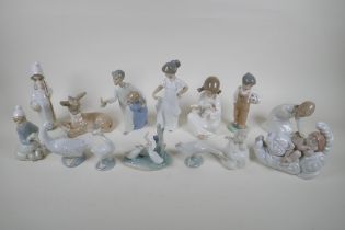 A collection of fourteen Lladro and Nao figurines and animals, largest 22cm high