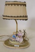 A continental porcelain table lamp, 37cm high with shade