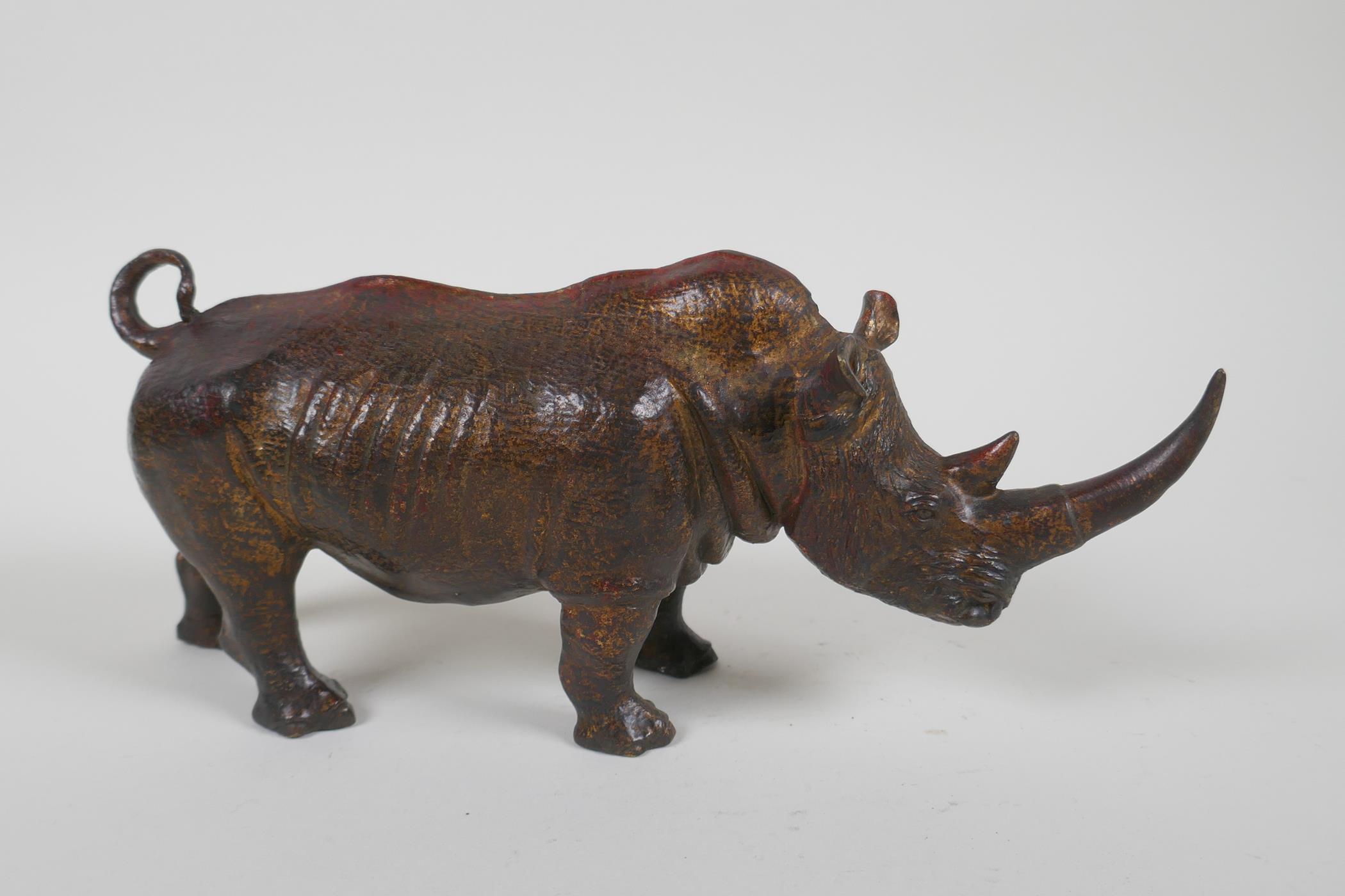 A gilt bronzed metal rhinoceros, filled, 25cm long - Image 2 of 3