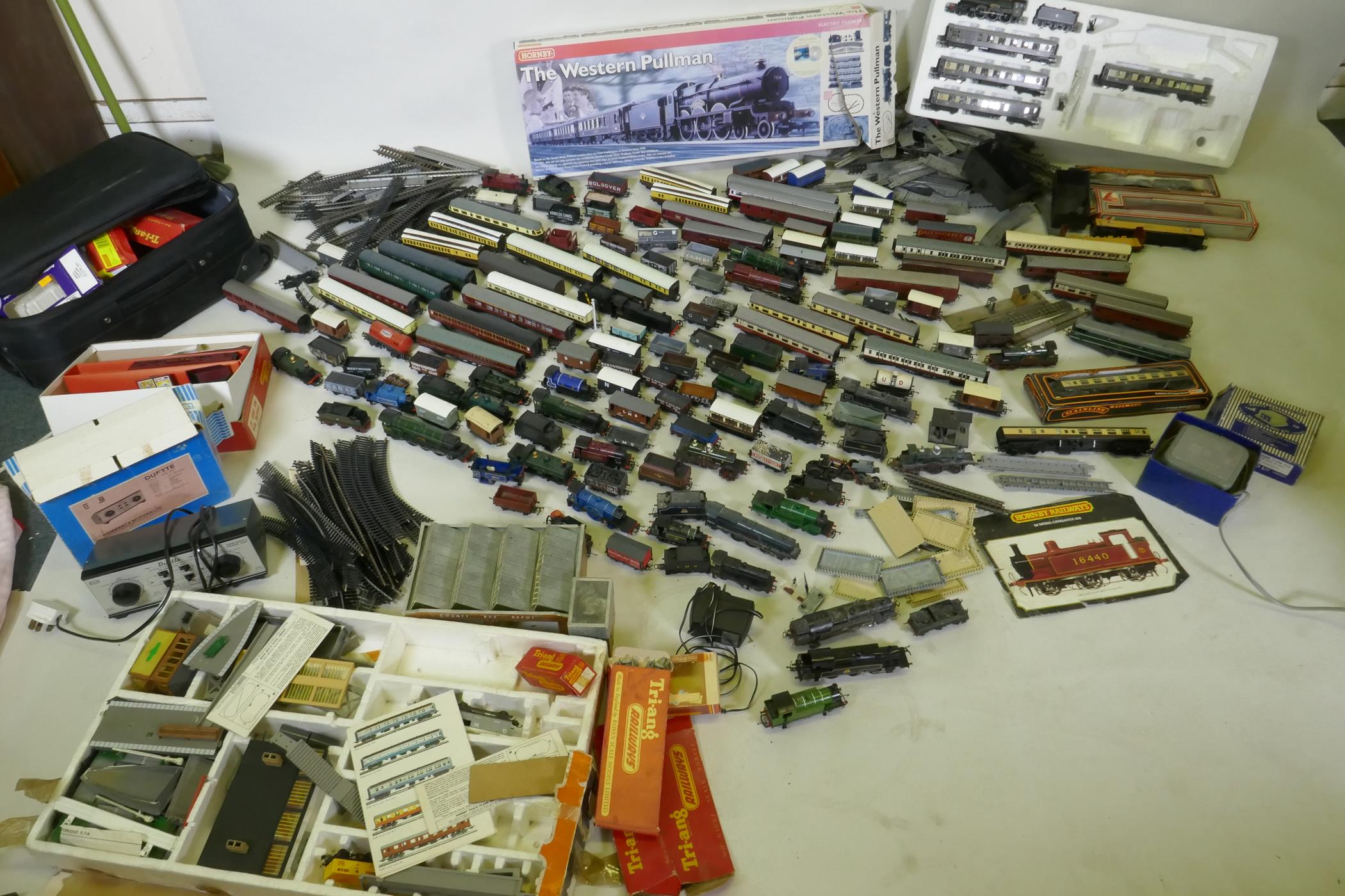 A quantity of Hornby, Triang, Lima H0-00 engines, rolling stock, transformers, track etc