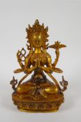 A Tibetan gilt bronze figure of a female deity, double vajra mark to base, 21cm high