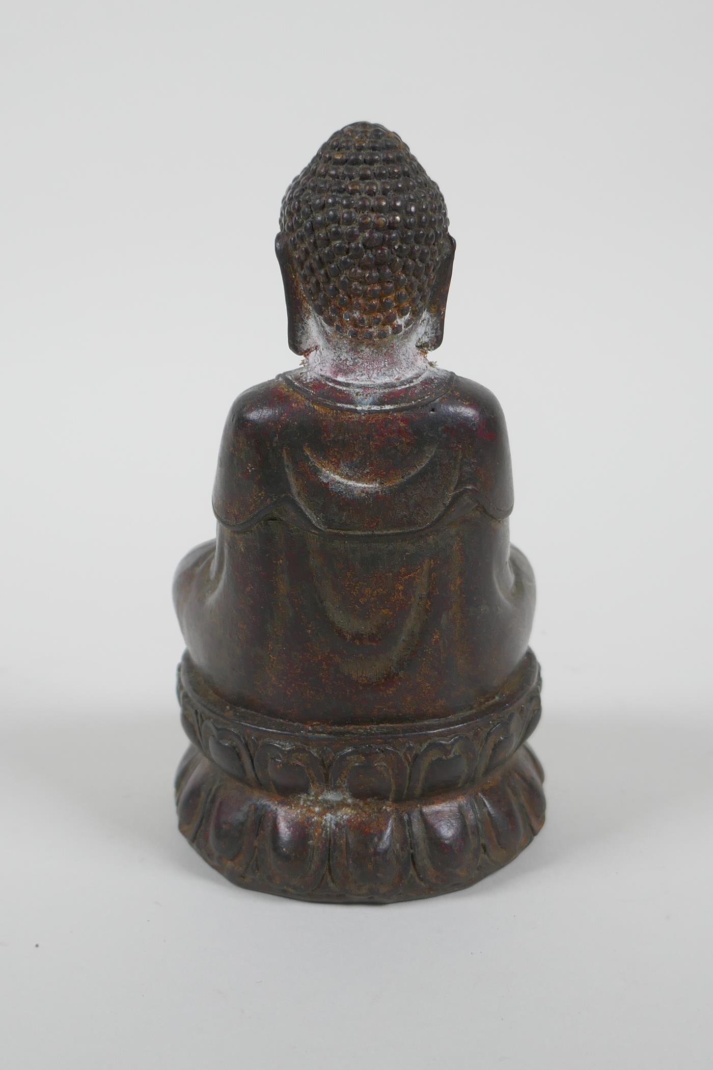A Chinese filled gilt bronze figure of Buddha, 4 character mark to base, 14cm high - Image 3 of 4