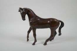 A filled bronze horse, 20cm high
