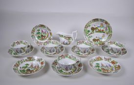 A late C18th/early C19th porcelain part tea service comprising five cups, eight saucers, milk jug
