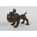 An oriental bronze caricature bulldog, mark to base, 8cm long