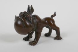 An oriental bronze caricature bulldog, mark to base, 8cm long