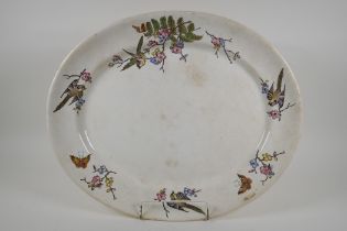 A large Victorian meat dish with transfer printed decoration of birds amongst flower and ferns,