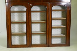 A Victorian mahogany bookcase top with three glazed arched doors, 183 x 32 x 134cm