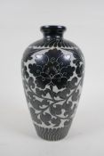 A late C19th/early C20th Chinese Cizhou kiln vase with chased lotus flower decoration, 26cm high