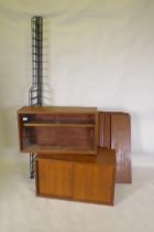 A mid century mahogany Ladderax style wall system of two cabinets and shelves, 178cm high