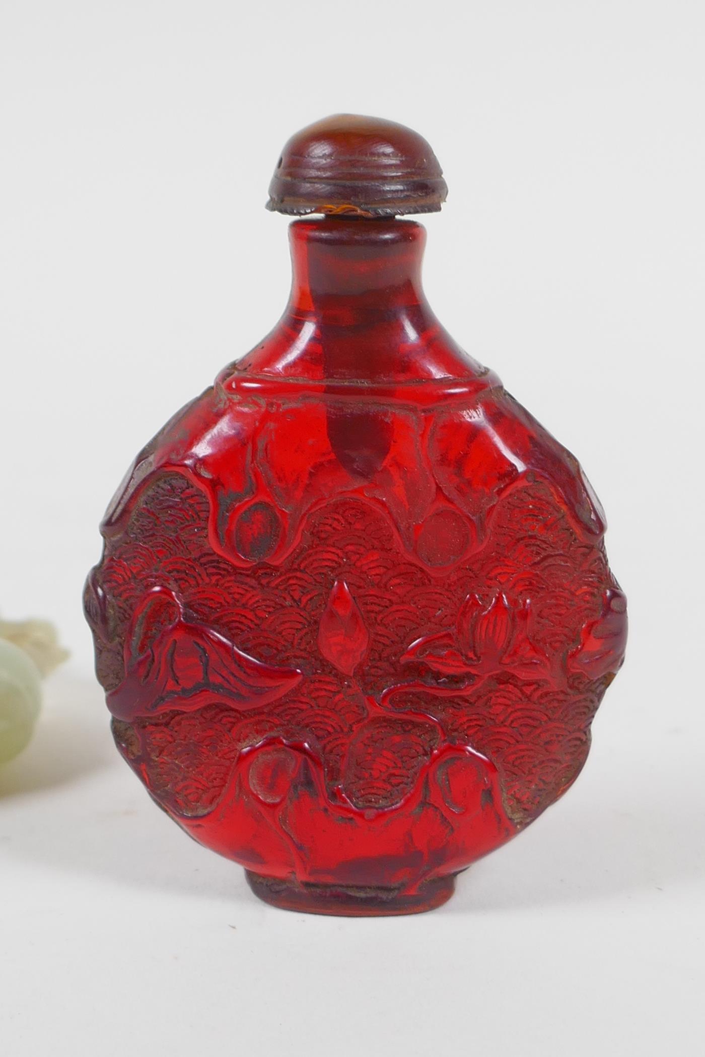 A Chinese carved hardstone roundel in the form of a deer, and a faux amber snuff bottle, 7cm high - Image 4 of 4
