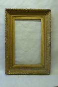 A large mid Victorian giltwood and composition picture frame, with acanthus and bead decoration,