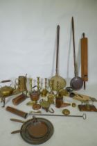 A quantity of copper and brass, footman skillets, candlesticks, bed warmers, set of postage scales