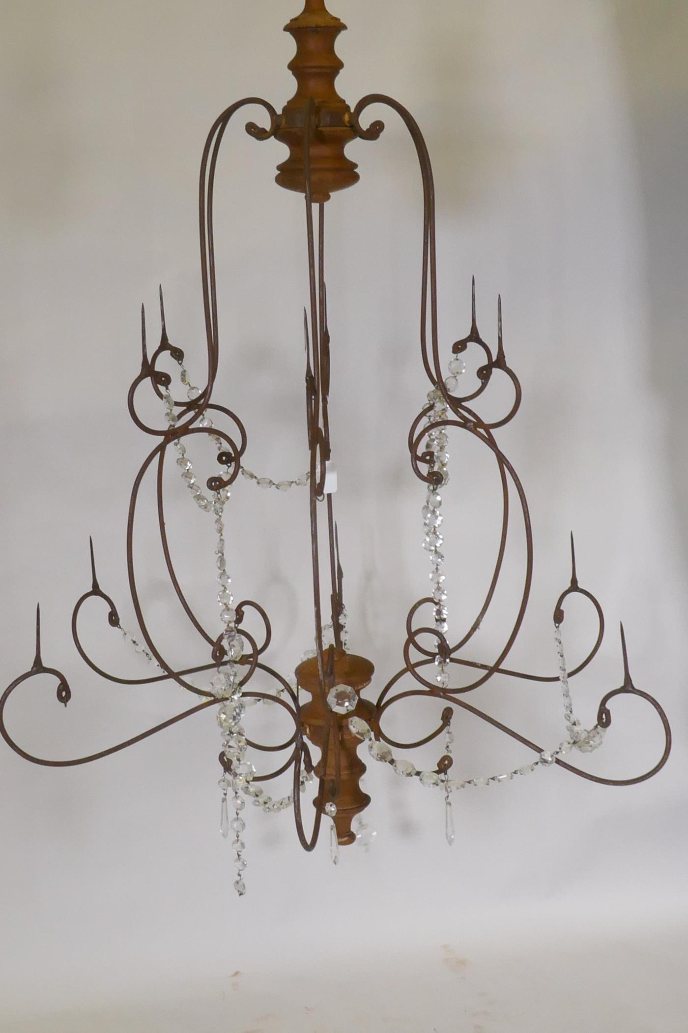 A wrought iron and pine six branch chandelier, with twelve candle prickets and glass lustre swags, - Image 2 of 2