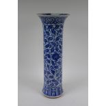 A C19th Chinese blue and white porcelain cylinder vase with allover scrolling floral decoration,